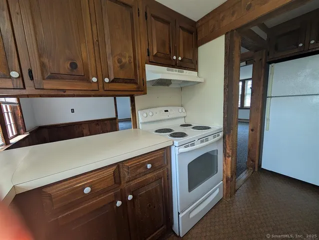 a kitchen with stainless steel appliances a stove and a refrigerator
