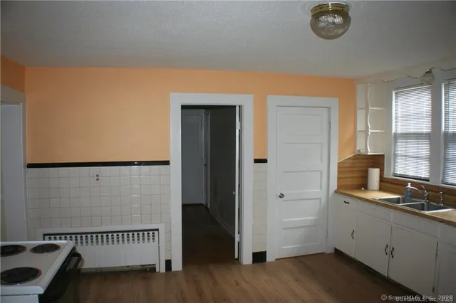 a bathroom with a tub and a window
