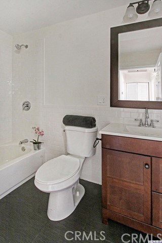 10563 Irma Avenue Tujunga, CA 91042 - Photo 15 of 25 a bathroom with a sink toilet and shower
