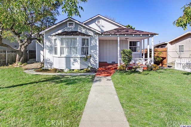 10563 Irma Avenue Tujunga, CA 91042 - Photo 2 of 25 a front view of a house with a yard