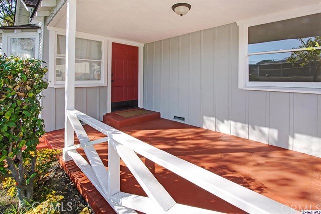 10563 Irma Avenue Tujunga, CA 91042 - Photo 3 of 25 a bedroom with a bed and a potted plant
