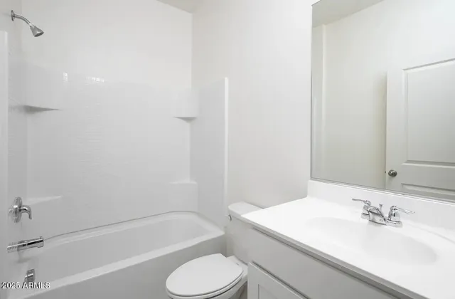 a bathroom with a sink toilet and bathtub