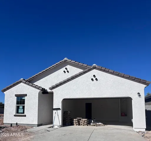 a front view of a house with a garage