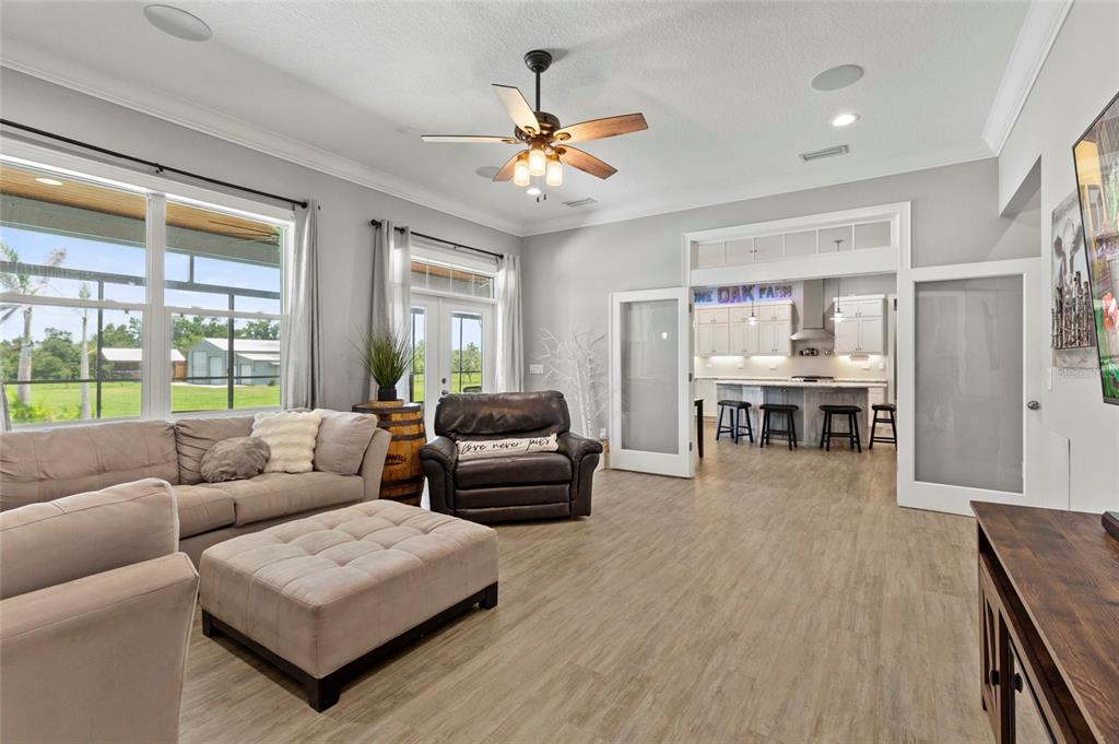 15710 Colding Loop Wimauma, FL 33598 - Photo 8 of 41 a living room with furniture and a large window