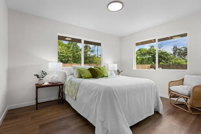 a bedroom with a bed and a chair