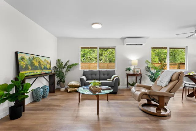a living room with furniture and a window