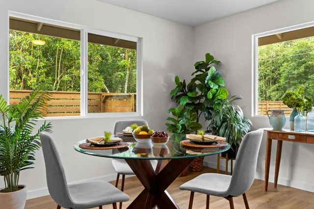 a view of a dining room with furniture window and outside view