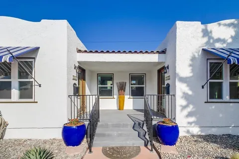 a view of a house with outdoor seating