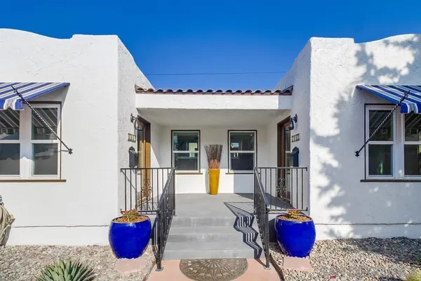 a view of a house with outdoor seating