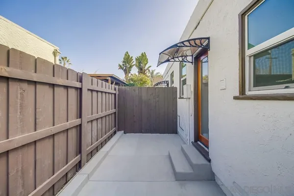 a kitchen with a stove and a refrigerator