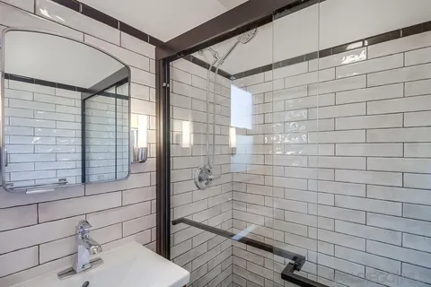 a kitchen with granite countertop cabinets stainless steel appliances and a window