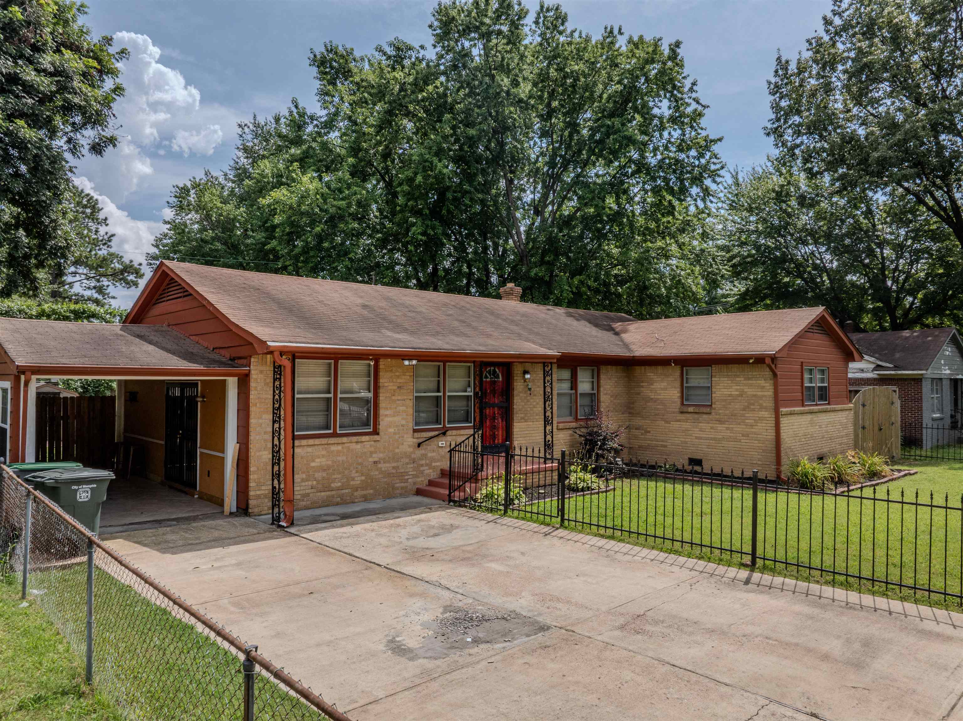 3953 Comanche Road Memphis, TN 38118 - Photo 1 of 24 Ranch-style house featuring brick siding, concrete driveway, and roof with shingles