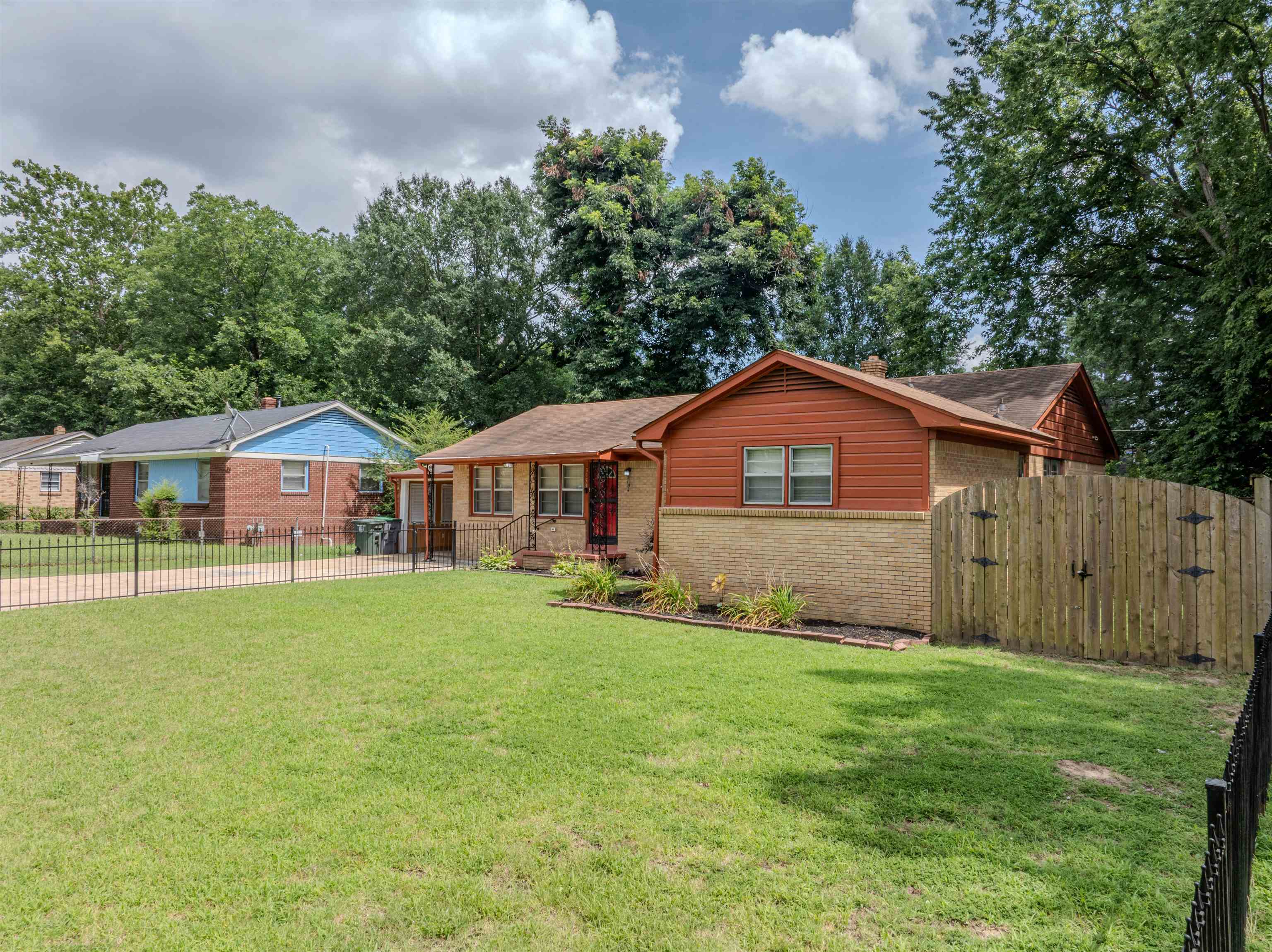 3953 Comanche Road Memphis, TN 38118 - Photo 2 of 24 Ranch-style home with brick siding and a gate