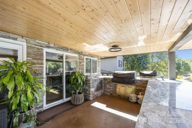 a kitchen with stainless steel appliances granite countertop sink stove and cabinets