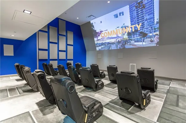 a living room with furniture a piano and a bookshelf