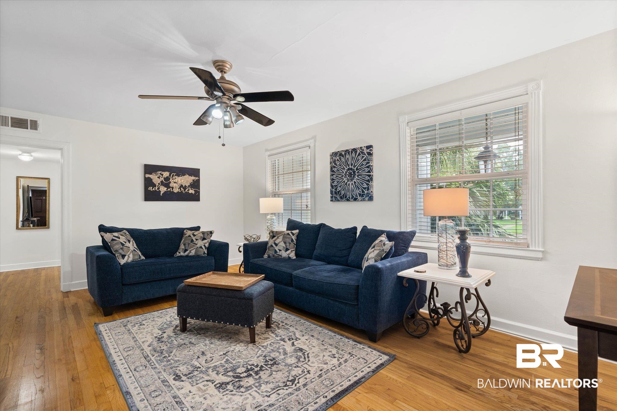 214 Upham Street, Unit 18A Mobile, AL 36607 - Photo 2 of 29 Living room with plenty of natural light, light wood finished floors, and ceiling fan