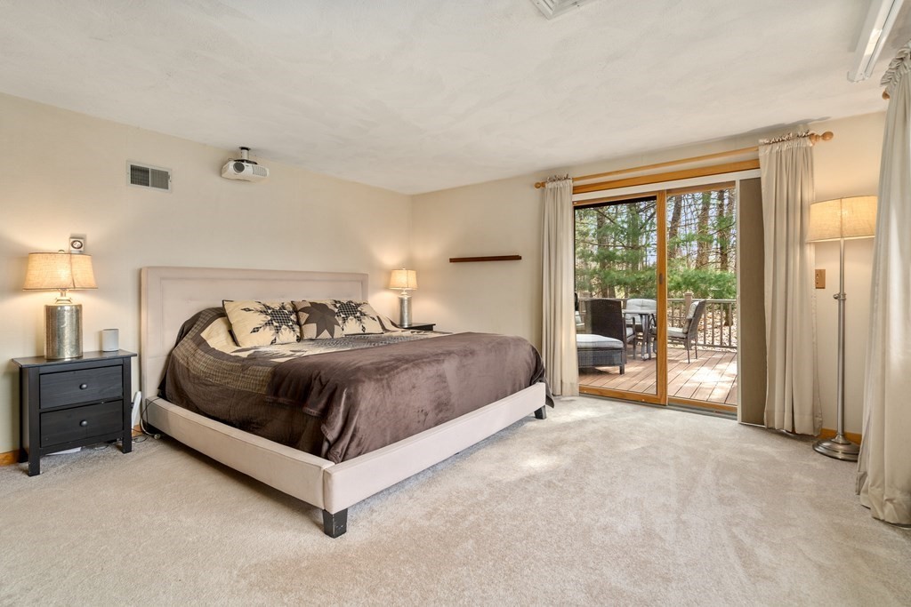 6 Crestwood Road North Reading, MA 01864 - Photo 12 of 36 a spacious bedroom with a bed and large window