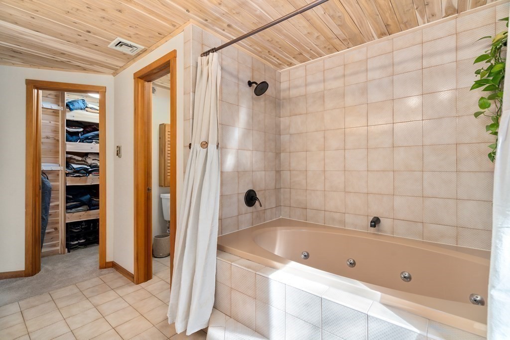 6 Crestwood Road North Reading, MA 01864 - Photo 14 of 36 a bathroom with a tub shower and closet