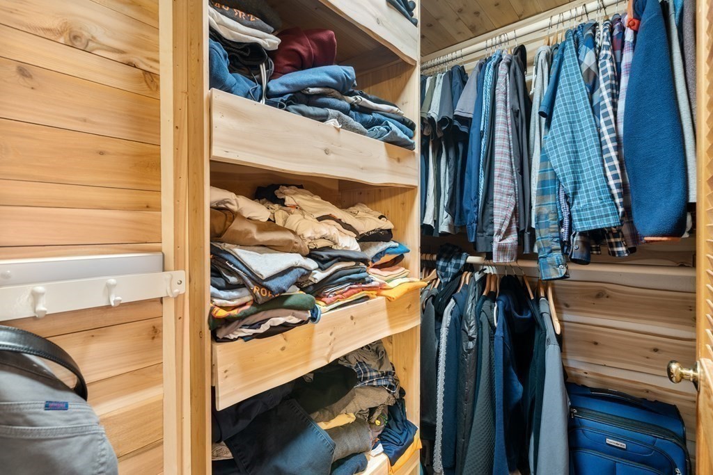 6 Crestwood Road North Reading, MA 01864 - Photo 15 of 36 a view of walk in closet with clothes and shoes