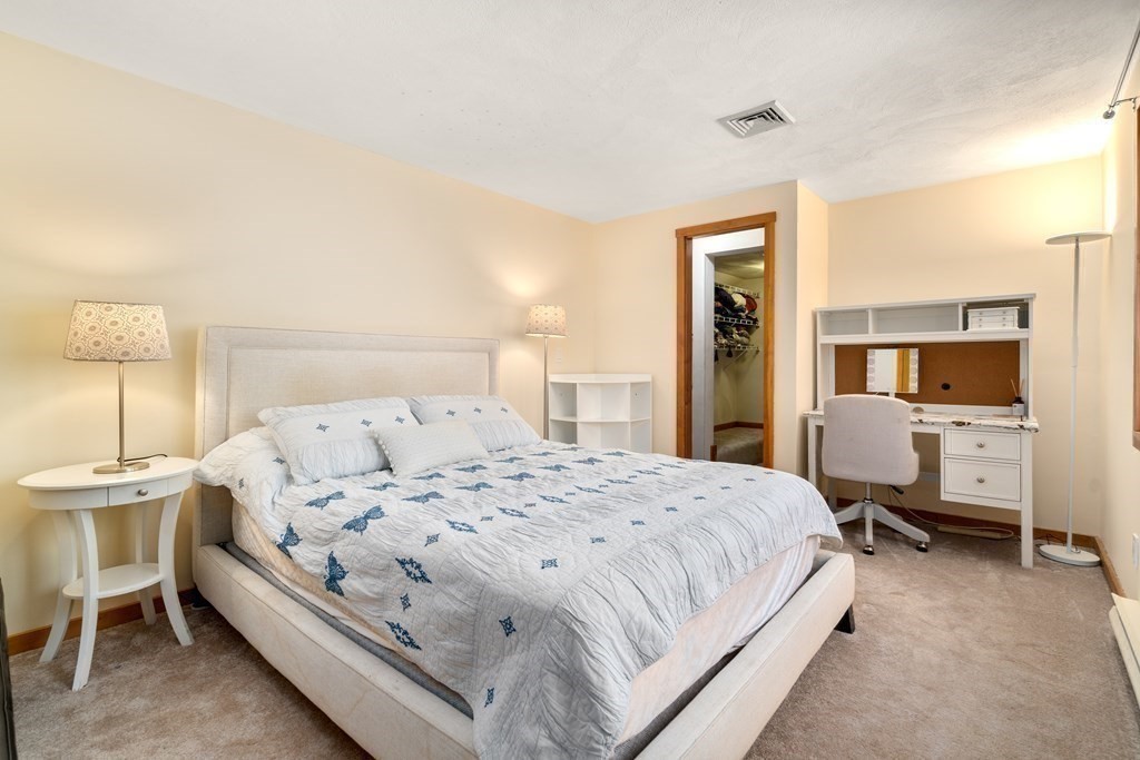 6 Crestwood Road North Reading, MA 01864 - Photo 16 of 36 a large bedroom with a bed and large cabinets