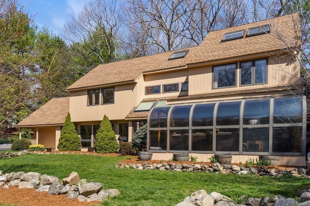 6 Crestwood Road North Reading, MA 01864 - Photo 2 of 36 a front view of a house with a yard table and chairs