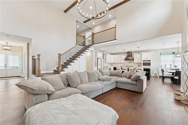 a living room with furniture chandelier and a chandelier