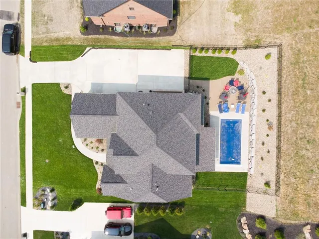 an aerial view of a house with outdoor space