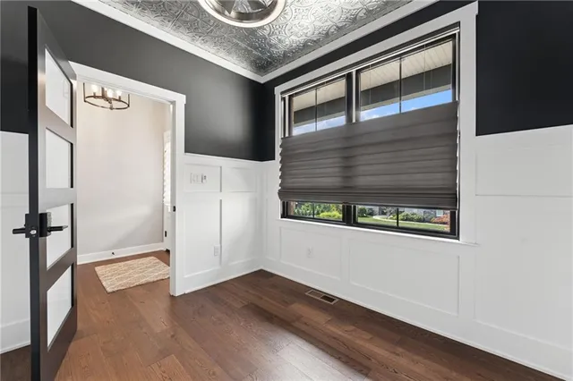 a kitchen with a refrigerator and a window