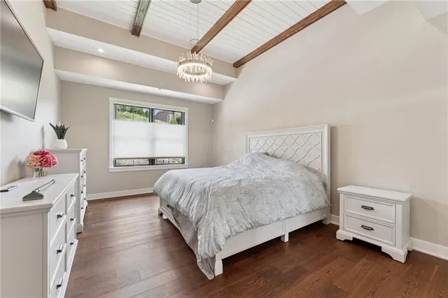 a bedroom with a bed and a dresser