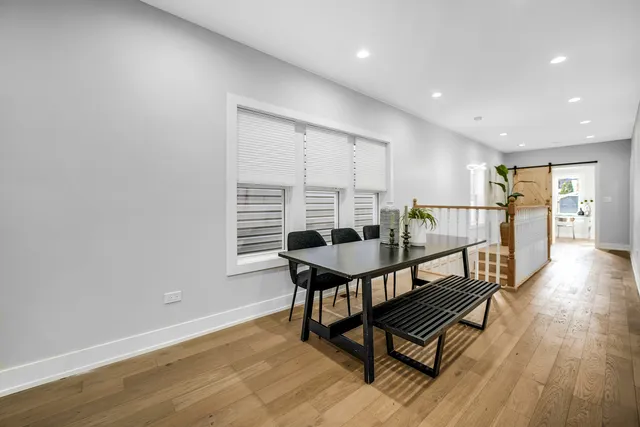 a view of a livingroom with furniture and wooden floor
