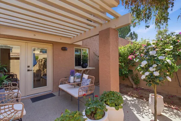 a outdoor living space with furniture and a potted plant