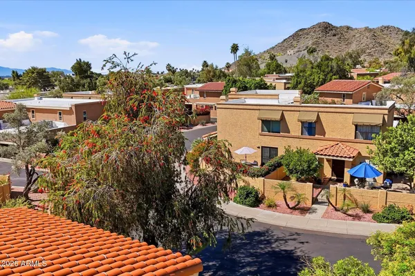 a aerial view of a house with a yard basket ball court and outdoor seating