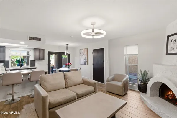 a living room with furniture and a lamp