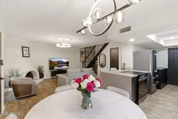 a living room with furniture potted plant and a fireplace