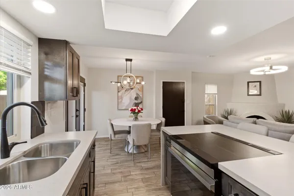 a kitchen with a refrigerator and a sink