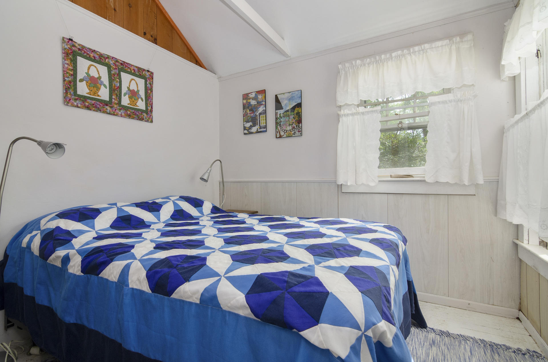 215 Pilgrim Spring Road, Unit 4 Wellfleet, MA 02667 - Photo 11 of 28 a bedroom with a bed and a window