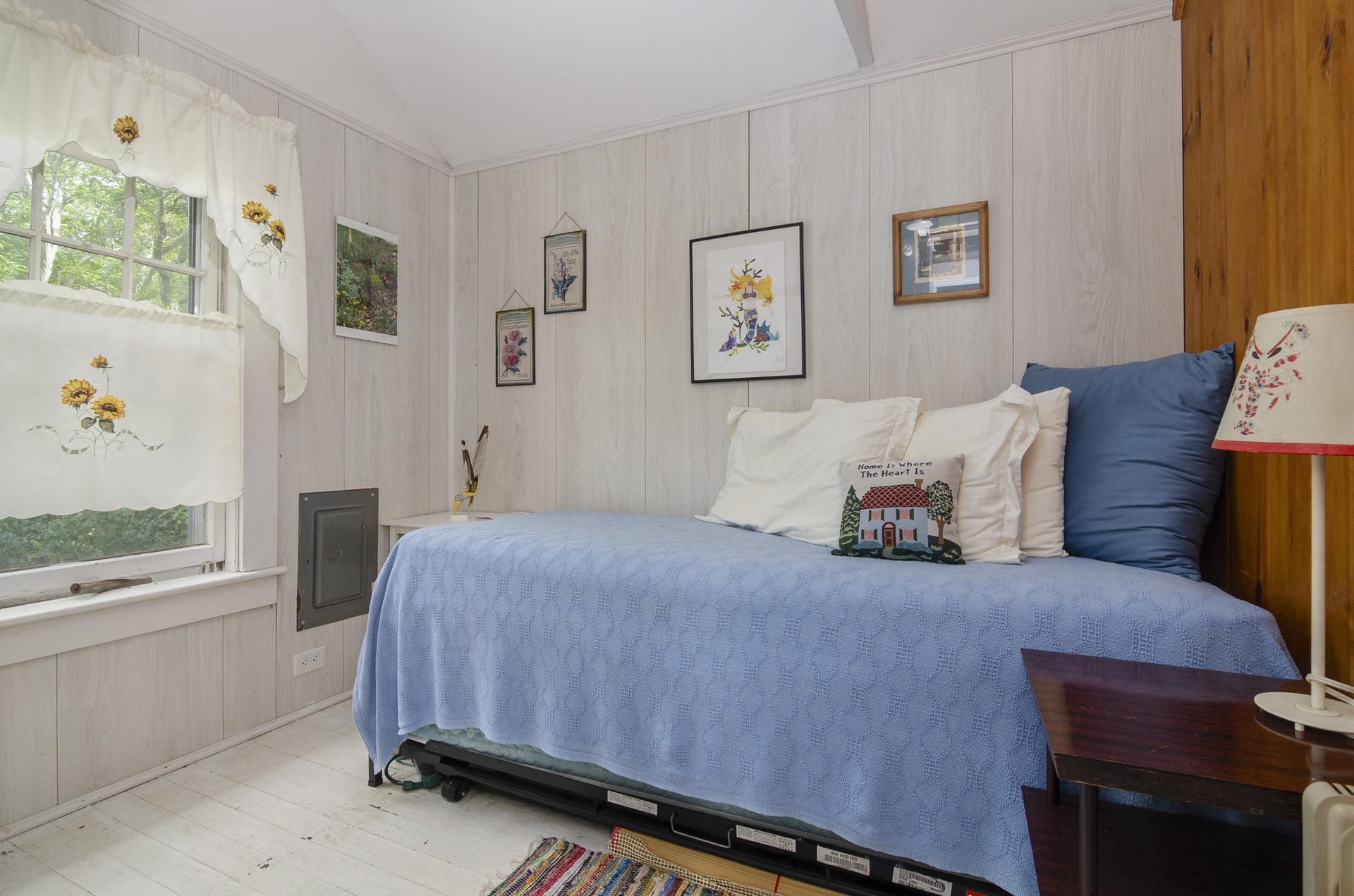 215 Pilgrim Spring Road, Unit 4 Wellfleet, MA 02667 - Photo 12 of 28 a bedroom with a bed and painting on the wall