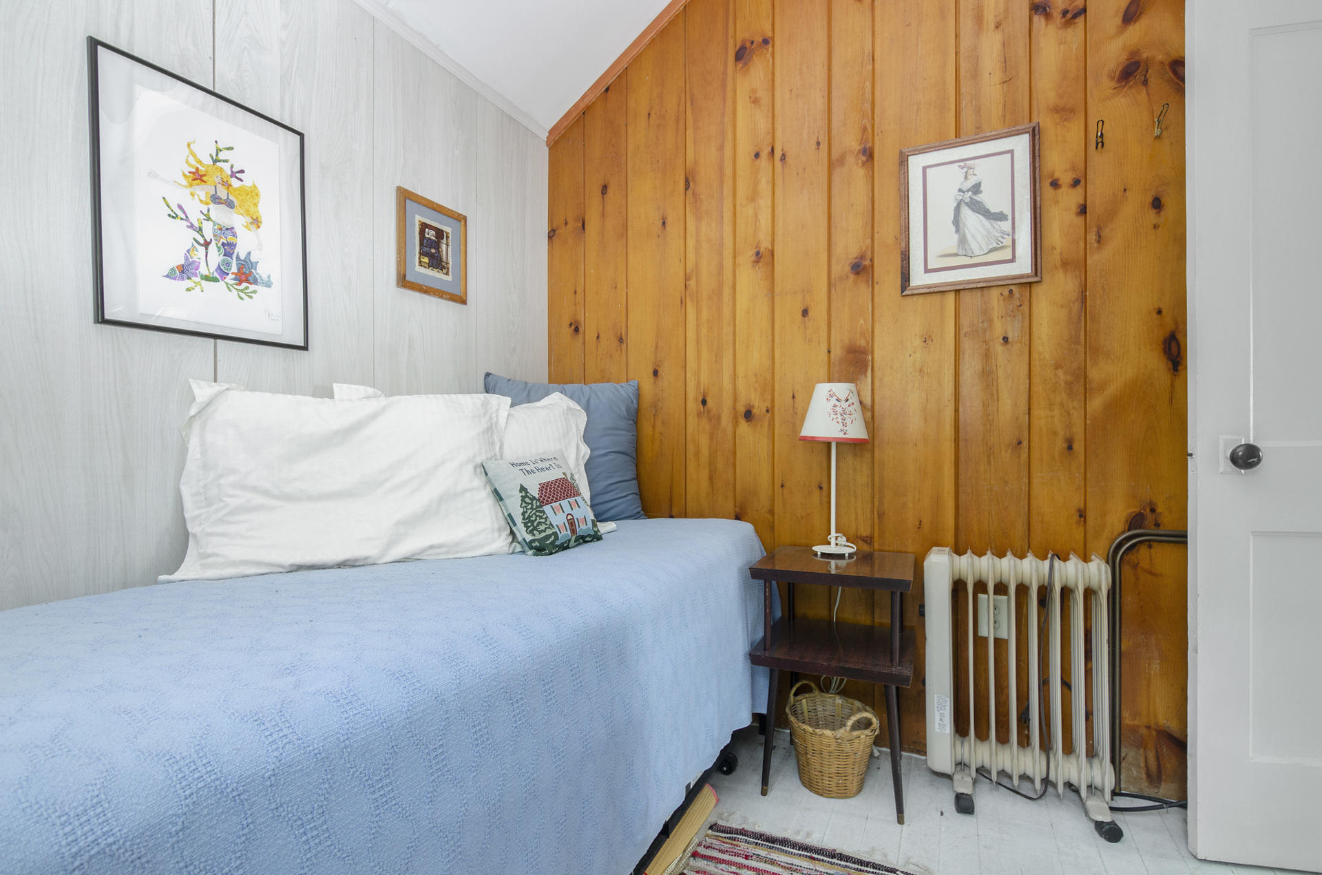 215 Pilgrim Spring Road, Unit 4 Wellfleet, MA 02667 - Photo 13 of 28 a bedroom with a bed and painting on the wall
