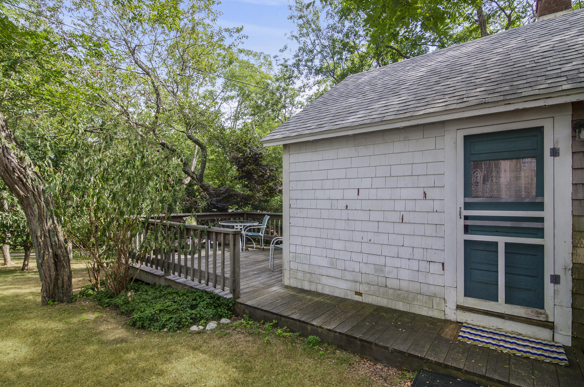 215 Pilgrim Spring Road, Unit 4 Wellfleet, MA 02667 - Photo 17 of 28 a view of a house with a small yard