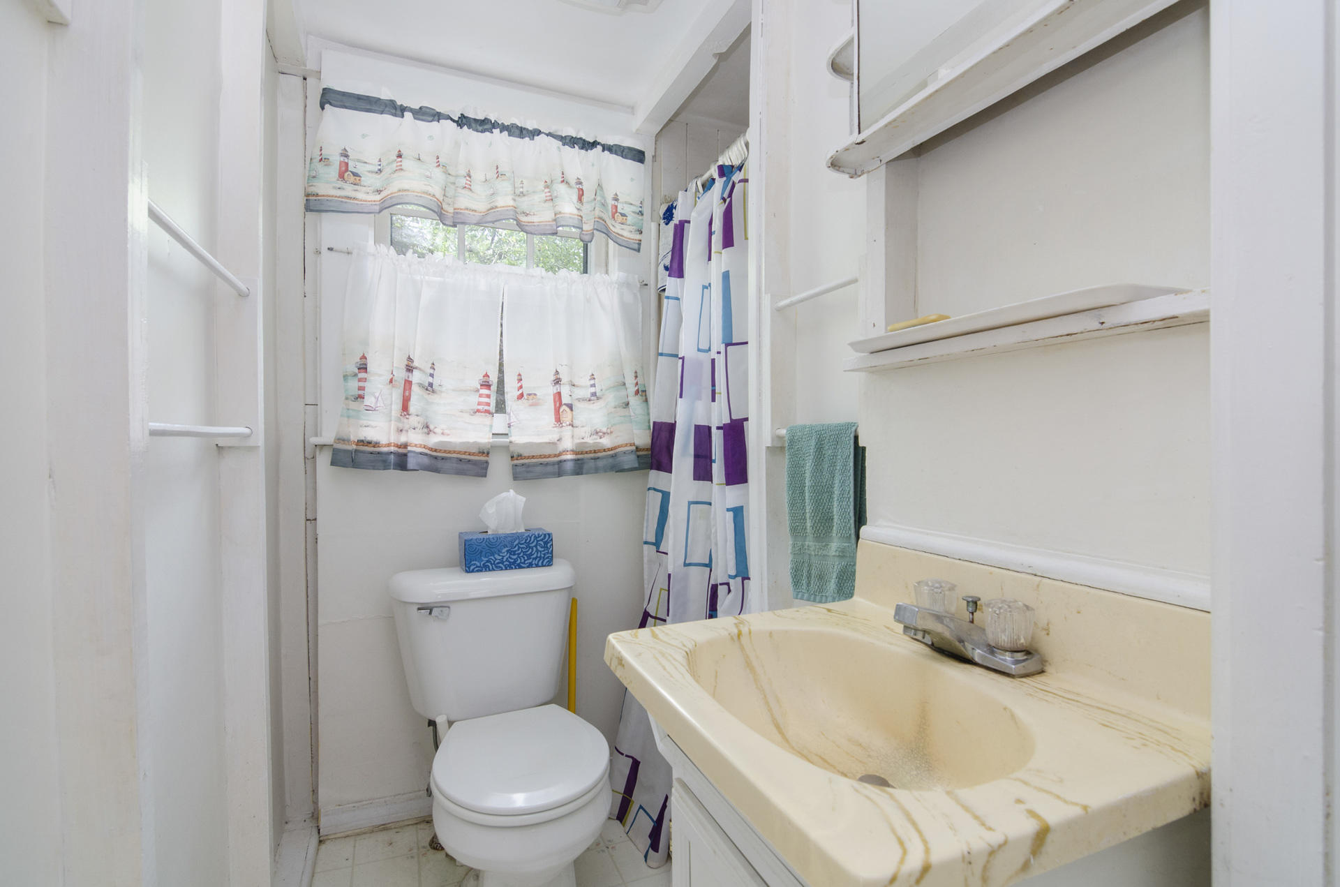 215 Pilgrim Spring Road, Unit 4 Wellfleet, MA 02667 - Photo 20 of 28 a bathroom with a sink a toilet and a mirror