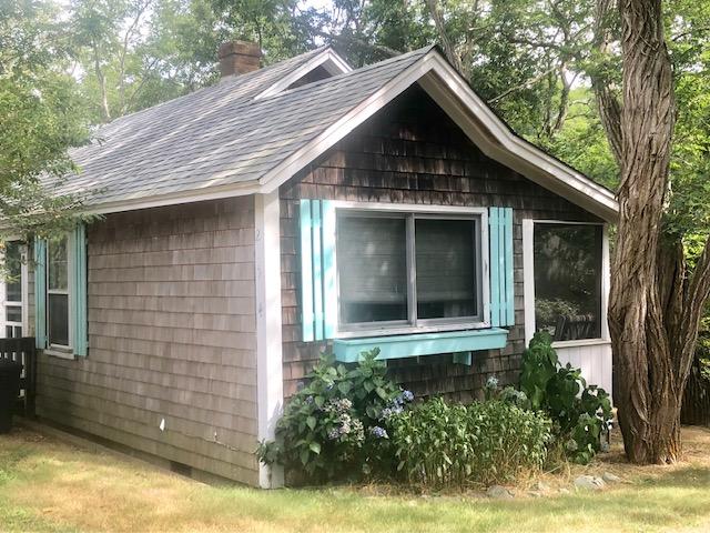 215 Pilgrim Spring Road, Unit 4 Wellfleet, MA 02667 - Photo 2 of 28 a front view of a house with garden