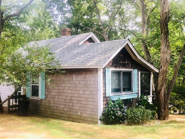215 Pilgrim Spring Road, Unit 4 Wellfleet, MA 02667 - Photo 21 of 28 a front view of a house with a yard