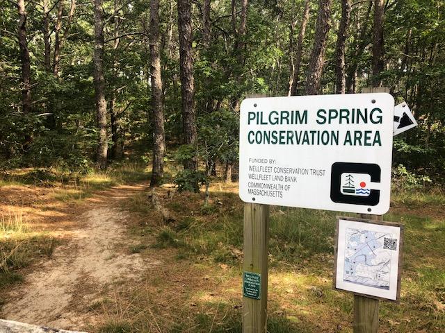 215 Pilgrim Spring Road, Unit 4 Wellfleet, MA 02667 - Photo 22 of 28 a sign on the side of a building