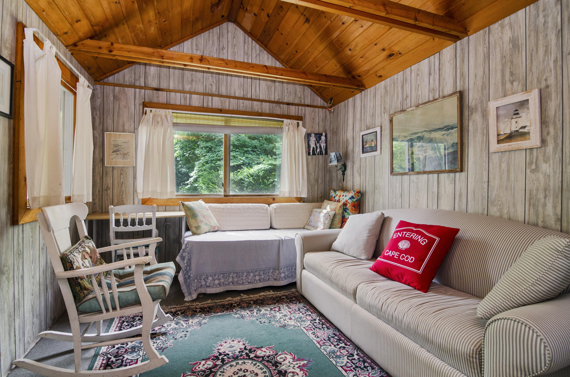 215 Pilgrim Spring Road, Unit 4 Wellfleet, MA 02667 - Photo 5 of 28 a living room with furniture and a large window