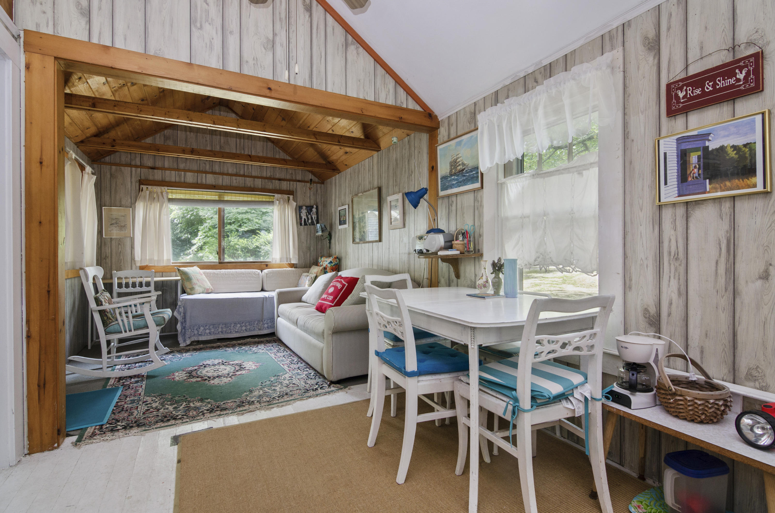 215 Pilgrim Spring Road, Unit 4 Wellfleet, MA 02667 - Photo 8 of 28 a dining room with furniture and a window