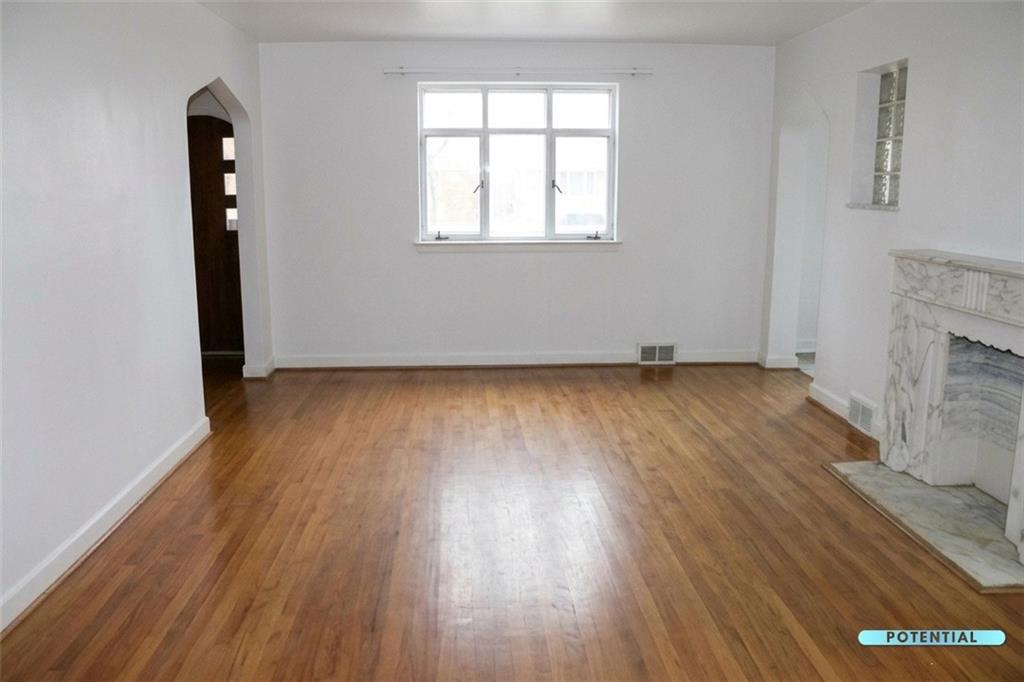 825 Liberty Street Duquesne, PA 15110 - Photo 18 of 25 an empty room with wooden floor and windows