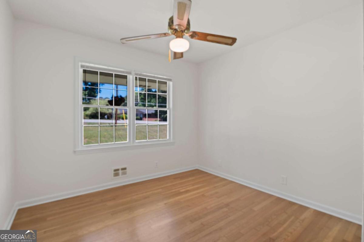 865 Old Tucker Road Stone Mountain, GA 30087 - Photo 26 of 57 a view of an empty room with a window