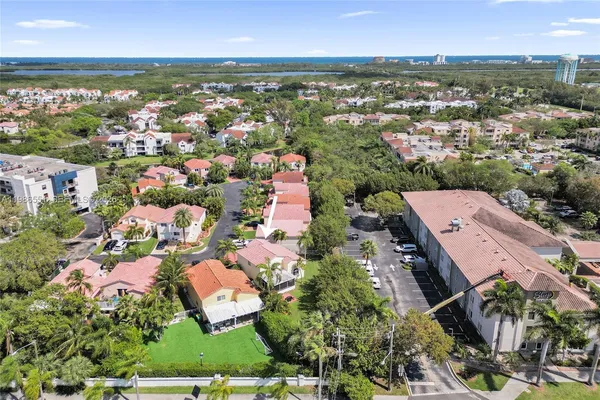 an aerial view of residential houses with outdoor space