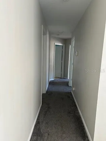 a view of patio with couches and pool