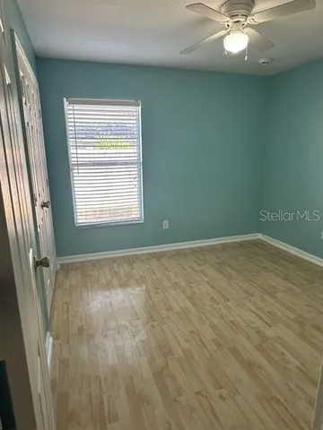 a view of a room with wooden walls
